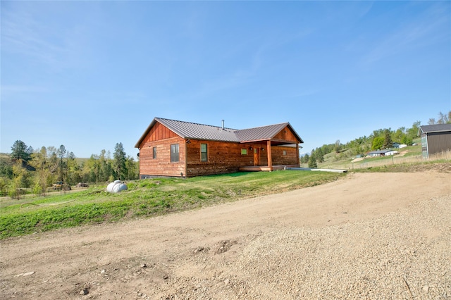 668 Dry Gulch Rd, Stevensville, MT 59870 - back of property with metal roof and a porch