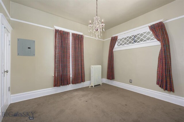 843 Lewisohn St, Butte, MT 59701 - carpeted empty room featuring radiator heating unit, electric panel, a chandelier, and baseboards