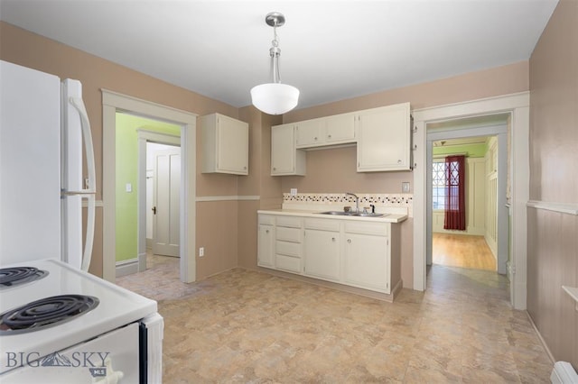 843 Lewisohn St, Butte, MT 59701 - kitchen featuring white appliances, a sink, decorative light fixtures, light countertops, and baseboards