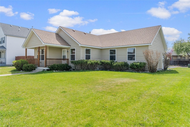 550 Green Tree Dr, Belgrade, MT 59714 - ranch-style home with a shingled roof, a porch, and a front yard