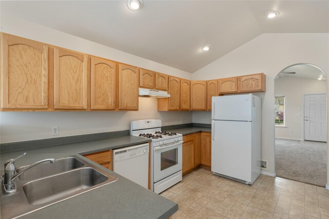 550 Green Tree Dr, Belgrade, MT 59714 - kitchen with white appliances, a sink, under cabinet range hood, arched walkways, and vaulted ceiling