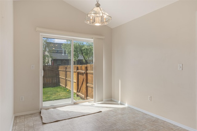 550 Green Tree Dr, Belgrade, MT 59714 - empty room with lofted ceiling, a chandelier, and baseboards