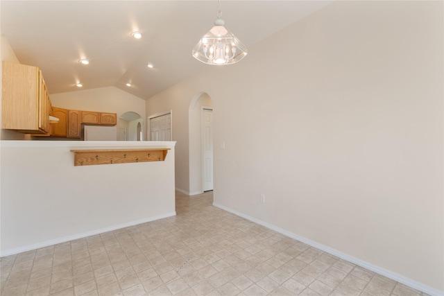 550 Green Tree Dr, Belgrade, MT 59714 - unfurnished room with arched walkways, lofted ceiling, baseboards, a chandelier, and recessed lighting