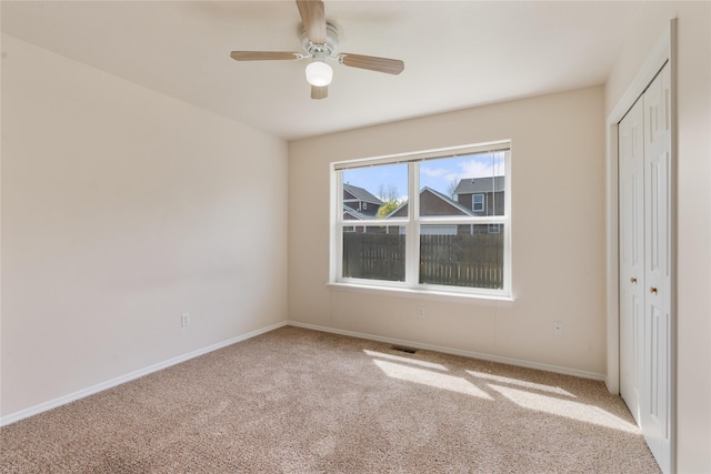 550 Green Tree Dr, Belgrade, MT 59714 - unfurnished bedroom with carpet floors, a closet, baseboards, and ceiling fan