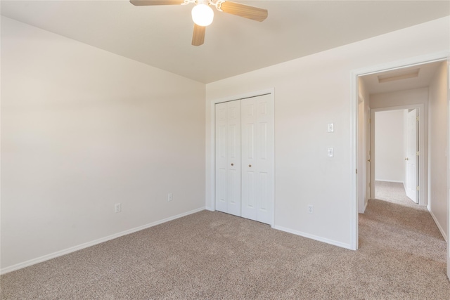 550 Green Tree Dr, Belgrade, MT 59714 - unfurnished bedroom featuring light carpet, baseboards, a closet, and ceiling fan