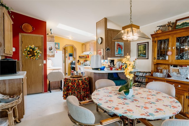 4242 Morningside Cir, Great Falls, MT 59405 - dining space featuring arched walkways, a chandelier, and vaulted ceiling