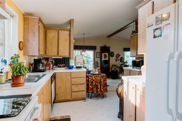 4242 Morningside Cir, Great Falls, MT 59405 - kitchen featuring freestanding refrigerator, light countertops, lofted ceiling, and dishwasher