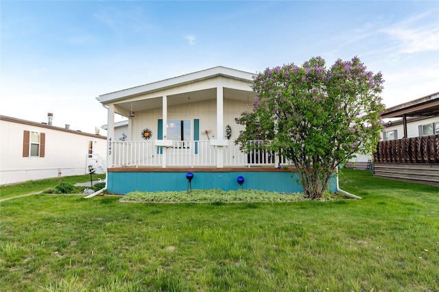 4242 Morningside Cir, Great Falls, MT 59405 - back of property featuring covered porch and a yard