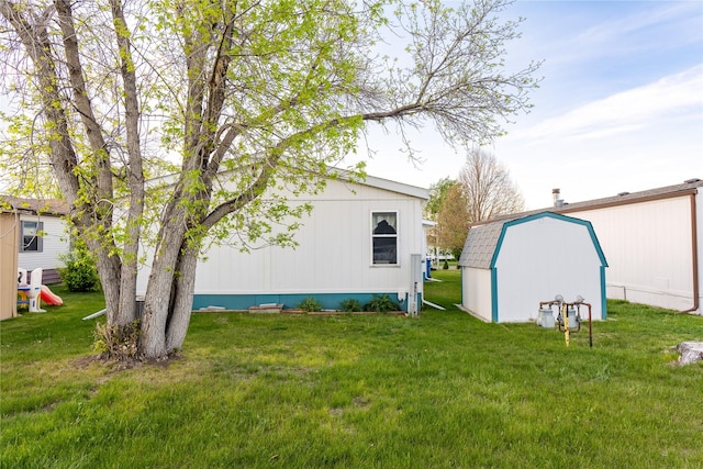 4242 Morningside Cir, Great Falls, MT 59405 - view of grassy yard featuring a shed and an outbuilding