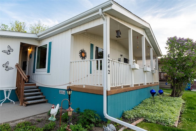 4242 Morningside Cir, Great Falls, MT 59405 - view of side of property featuring a porch