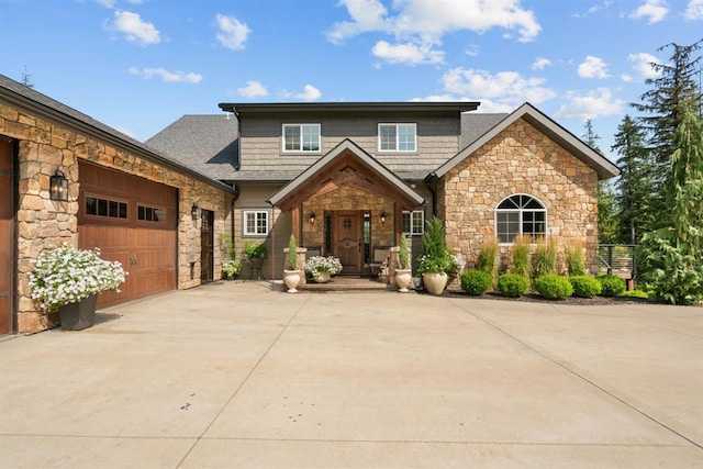 15 Sandi Ln, Heron, MT 59844 - craftsman-style home featuring stone siding, concrete driveway, and a garage