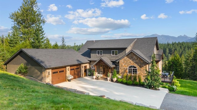 15 Sandi Ln, Heron, MT 59844 - craftsman-style home featuring stone siding, a garage, driveway, and a front lawn