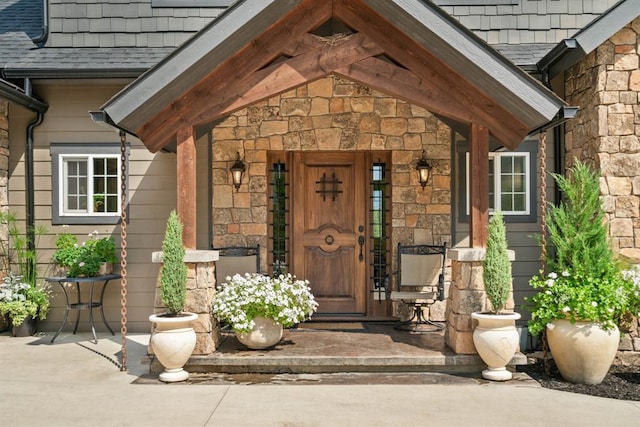 15 Sandi Ln, Heron, MT 59844 - property entrance featuring stone siding, a porch, and a shingled roof