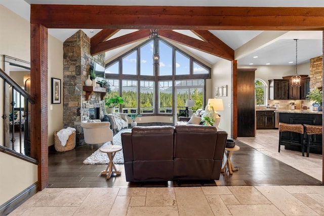 15 Sandi Ln, Heron, MT 59844 - living room with beamed ceiling, a fireplace, high vaulted ceiling, stone tile floors, and recessed lighting