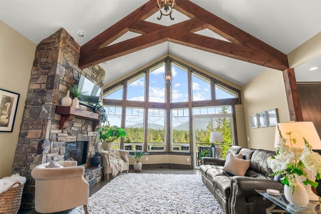 15 Sandi Ln, Heron, MT 59844 - living room with a stone fireplace, high vaulted ceiling, and wood finished floors