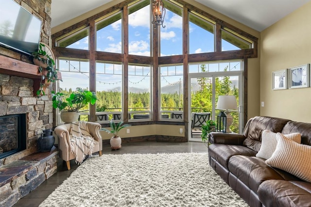 15 Sandi Ln, Heron, MT 59844 - living room featuring vaulted ceiling, a stone fireplace, and wood finished floors