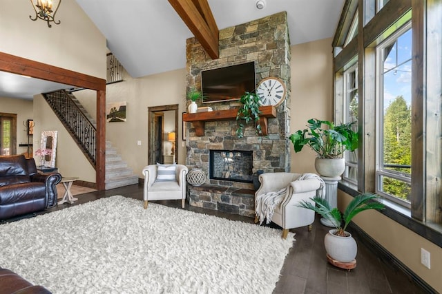 15 Sandi Ln, Heron, MT 59844 - living room featuring a fireplace, stairs, wood finished floors, beam ceiling, and high vaulted ceiling