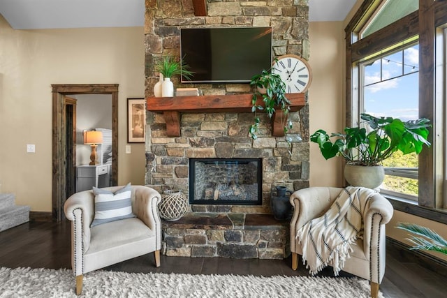 15 Sandi Ln, Heron, MT 59844 - living room with a fireplace, wood finished floors, plenty of natural light, and baseboards