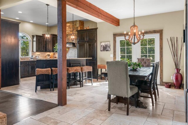 15 Sandi Ln, Heron, MT 59844 - dining room with a chandelier, stone tile floors, recessed lighting, and beam ceiling