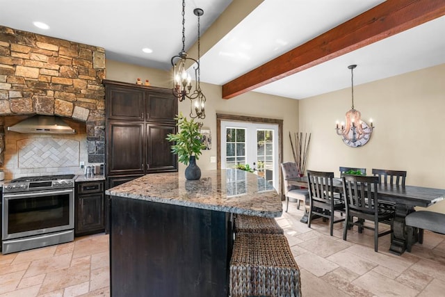 15 Sandi Ln, Heron, MT 59844 - kitchen featuring gas stove, a chandelier, stone tile flooring, backsplash, and light stone counters