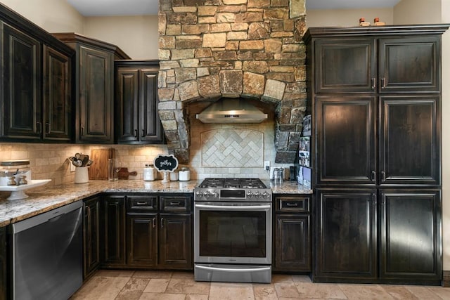 15 Sandi Ln, Heron, MT 59844 - kitchen featuring appliances with stainless steel finishes, tasteful backsplash, and light stone countertops
