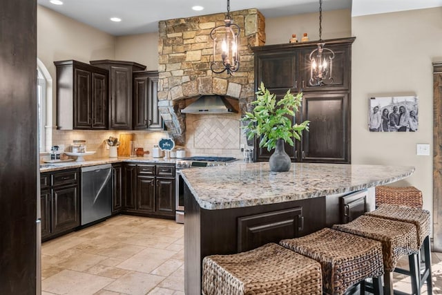 15 Sandi Ln, Heron, MT 59844 - kitchen featuring stainless steel appliances, tasteful backsplash, a kitchen island, a breakfast bar area, and a chandelier