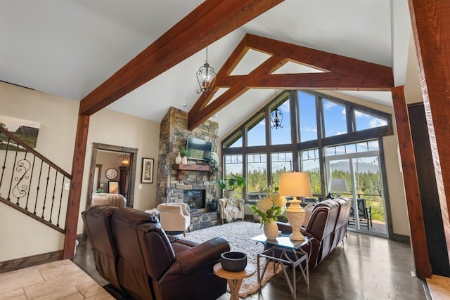 15 Sandi Ln, Heron, MT 59844 - living room featuring beam ceiling, a fireplace, high vaulted ceiling, baseboards, and stairway