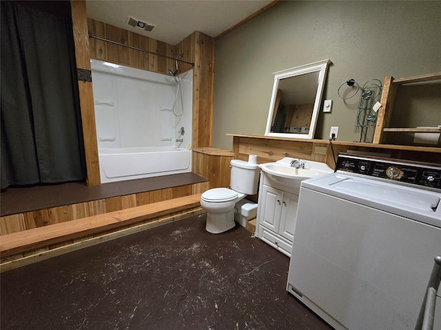 401 Western Larch Ln, Yaak, MT 59935 - full bathroom with washer / clothes dryer, vanity, toilet, bathing tub / shower combination, and finished concrete flooring