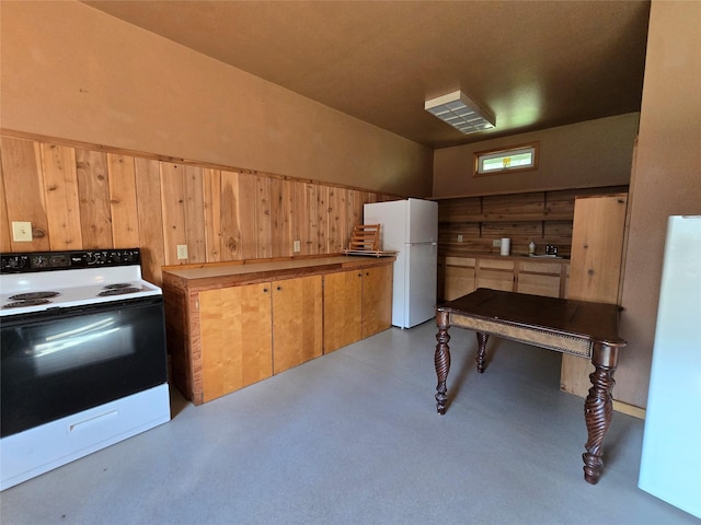 401 Western Larch Ln, Yaak, MT 59935 - kitchen featuring range with electric cooktop, freestanding refrigerator, and a sink