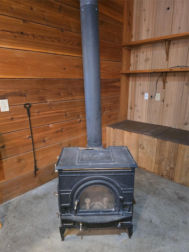 401 Western Larch Ln, Yaak, MT 59935 - detailed view of a wood stove, wood walls, and carpet floors