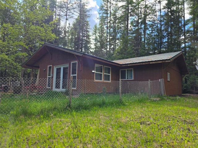 401 Western Larch Ln, Yaak, MT 59935 - view of side of home featuring metal roof and french doors