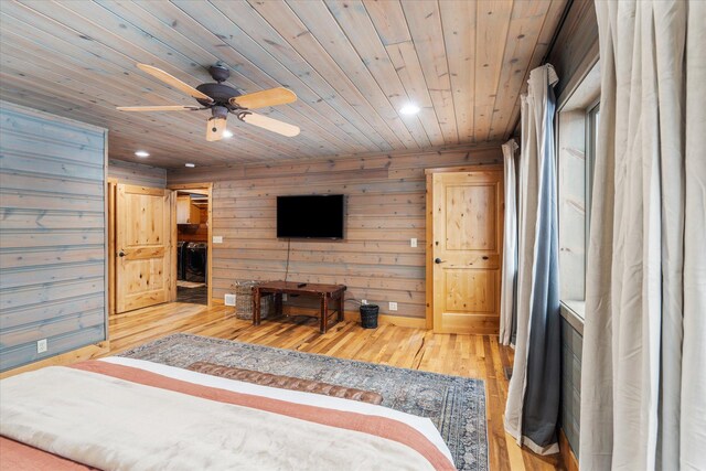 655 Leksand Trl, Whitefish, MT 59937 - bedroom featuring hardwood / wood-style floors, wooden ceiling, recessed lighting, wood walls, and washer / dryer
