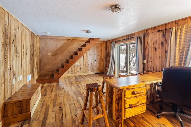 655 Leksand Trl, Whitefish, MT 59937 - office with wooden walls, hardwood / wood-style floors, and a textured ceiling