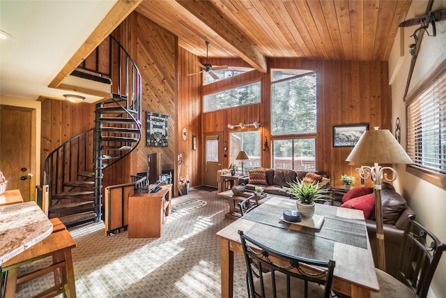97 Cedar Way Unit 97, Whitefish, MT 59937 - living area with wood walls, stairway, ceiling fan, wood ceiling, and carpet floors