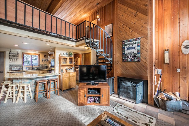 97 Cedar Way Unit 97, Whitefish, MT 59937 - living area featuring wooden walls, stairs, a high ceiling, recessed lighting, and wood ceiling