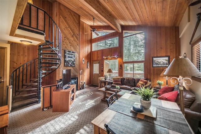97 Cedar Way Unit 97, Whitefish, MT 59937 - living room with wooden walls, carpet floors, stairway, ceiling fan, and wood ceiling