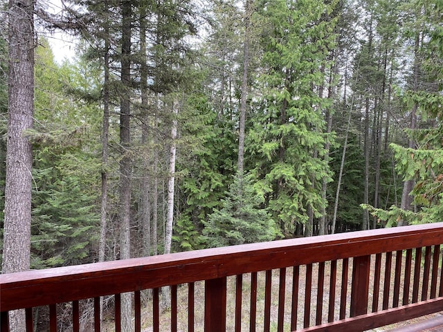 97 Cedar Way Unit 97, Whitefish, MT 59937 - wooden terrace with a view of trees