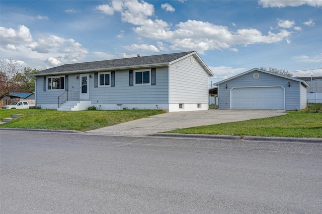single story home featuring a detached garage, an outbuilding, and a front yard