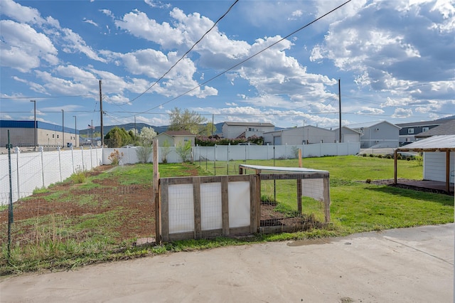 view of storm shelter featuring a shed, a residential view, and an outdoor structure