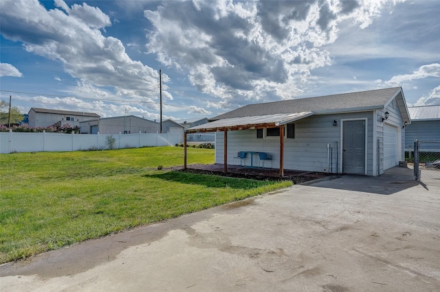 view of outdoor structure with a garage and concrete driveway