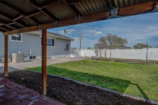 view of yard with cooling unit and a patio