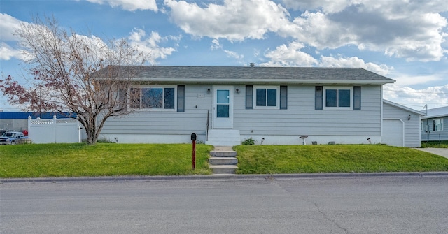 ranch-style home with entry steps and a garage