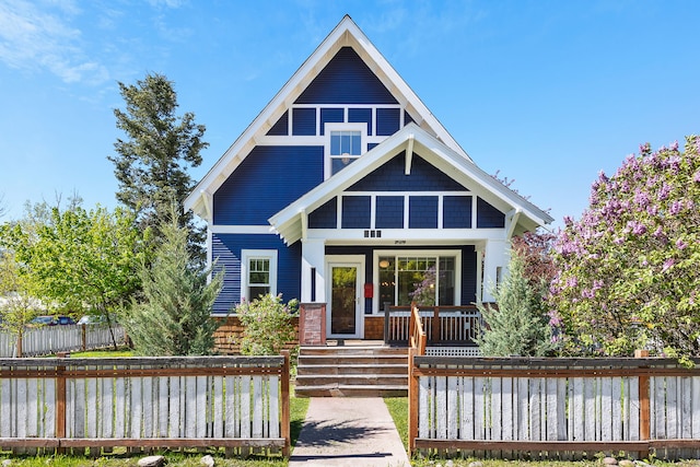 705 N 3rd St W, Missoula, MT 59802 - view of front of home with covered porch and a fenced front yard
