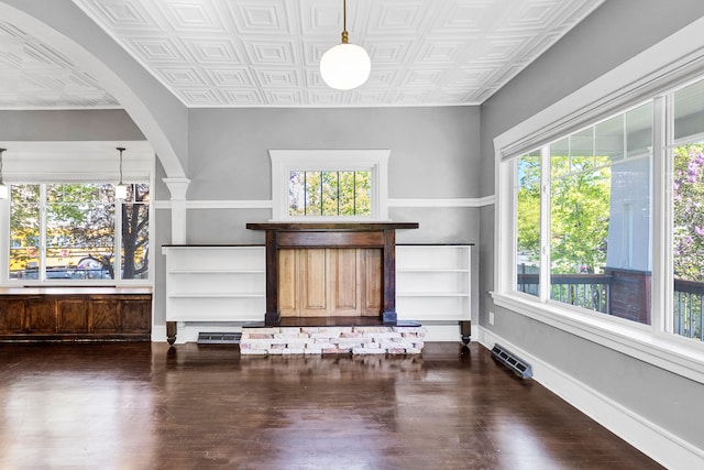 705 N 3rd St W, Missoula, MT 59802 - living room with plenty of natural light, dark wood-style flooring, and an ornate ceiling