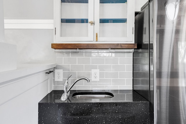 705 N 3rd St W, Missoula, MT 59802 - kitchen featuring a sink, tasteful backsplash, freestanding refrigerator, and white cabinetry