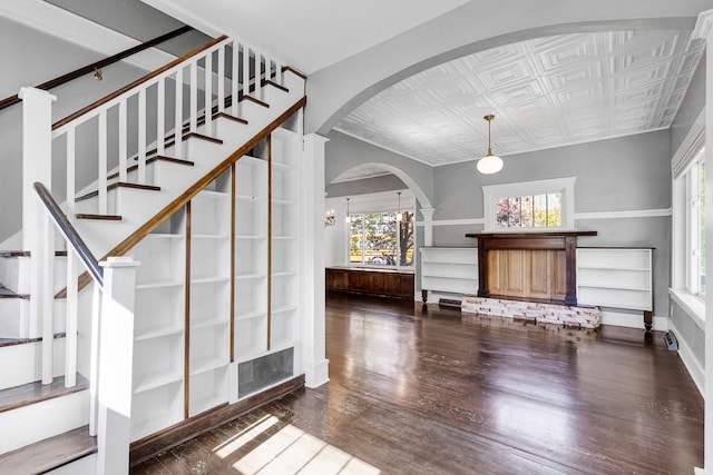 705 N 3rd St W, Missoula, MT 59802 - stairway featuring an ornate ceiling, wood finished floors, healthy amount of natural light, and arched walkways