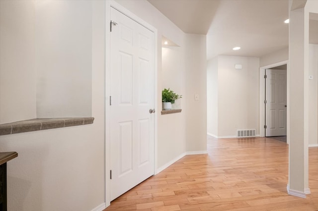 entrance foyer with light wood-style floors, recessed lighting, and baseboards