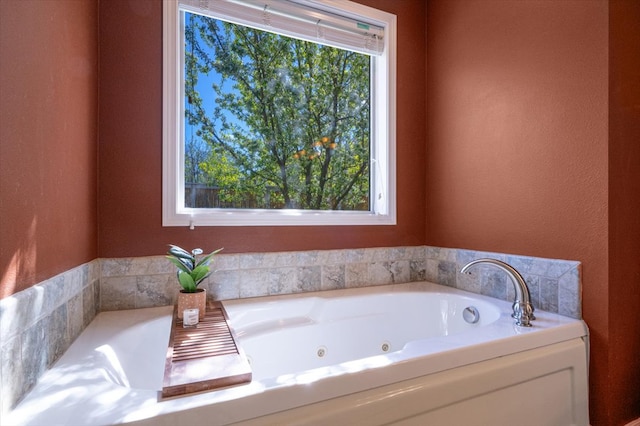 bathroom featuring a tub with jets