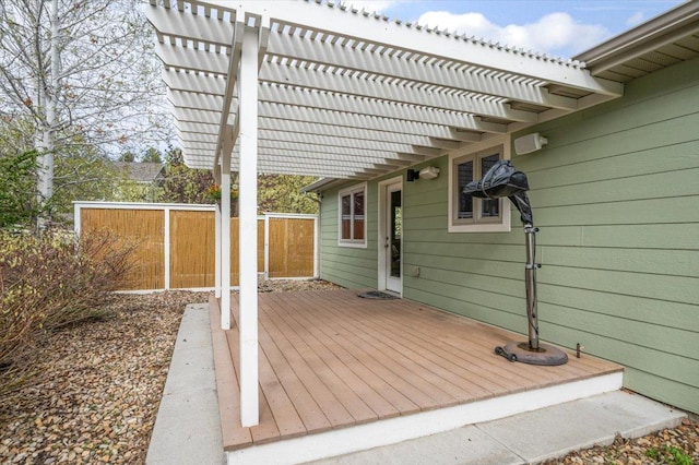wooden terrace with a pergola and fence