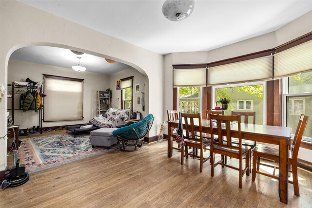 528 3rd Ave E, Kalispell, MT 59901 - dining area featuring arched walkways, wood finished floors, and baseboards